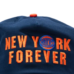 NEW ERA 19TWENTY NEW YORK KNICKS 2026 NBA CHAMPIONS PATCH NEW YORK FOREVER SNAPBACK PRE-CURVED HAT