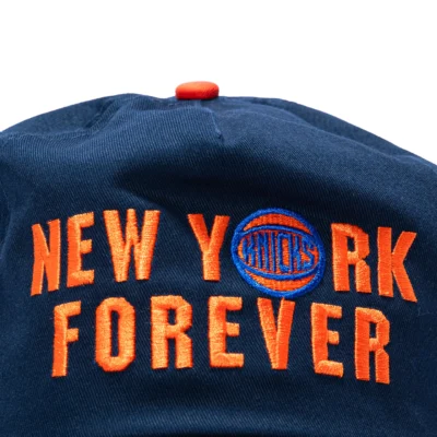 NEW ERA 19TWENTY NEW YORK KNICKS 2026 NBA CHAMPIONS PATCH NEW YORK FOREVER SNAPBACK PRE-CURVED HAT